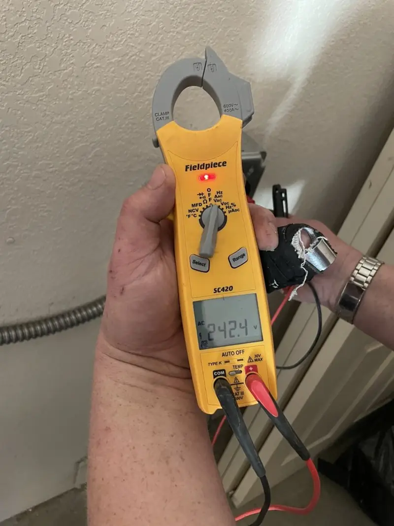 Voltage testing with clamp meter during Ceiling Fan Installation in Larch Way